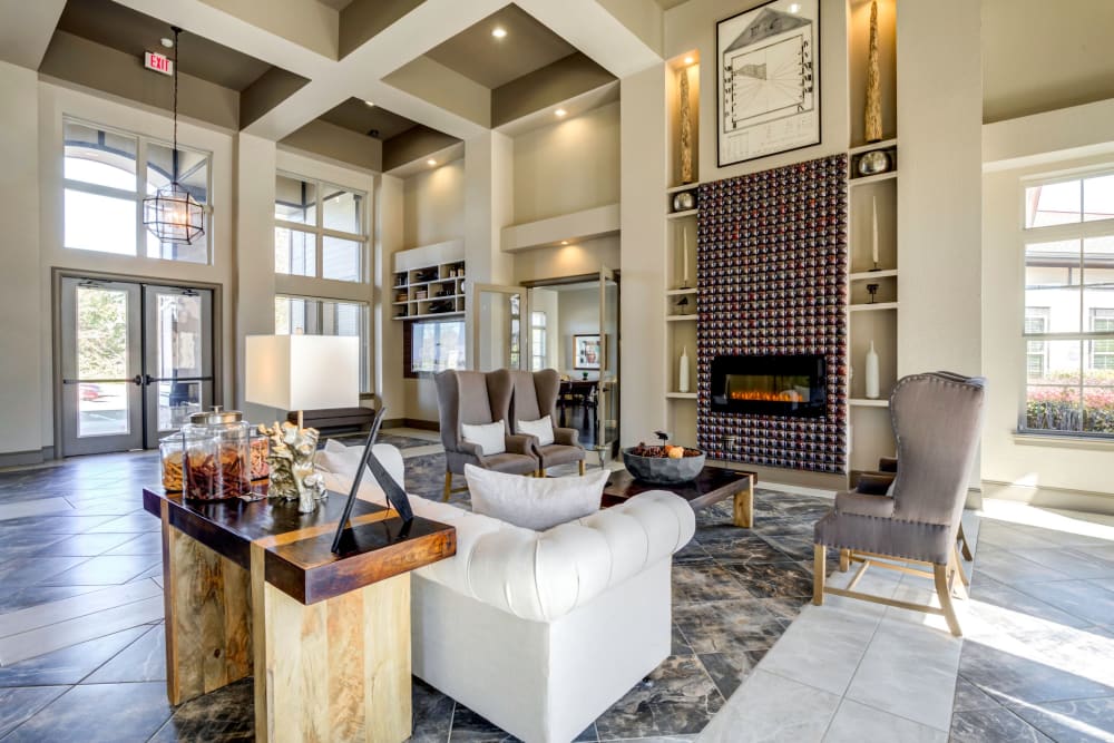 Clubhouse interior with plenty of seating for entertaining guests at The Addison at South Tryon in Charlotte, North Carolina