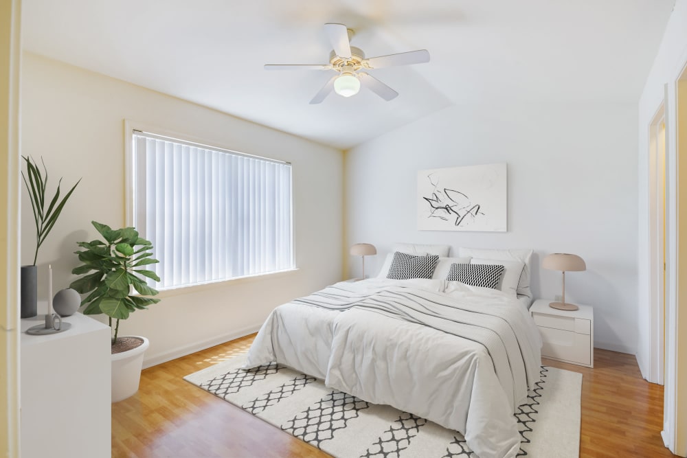 A bright, furnished bedroom in a home at Midway Manor in Virgina Beach, Virginia