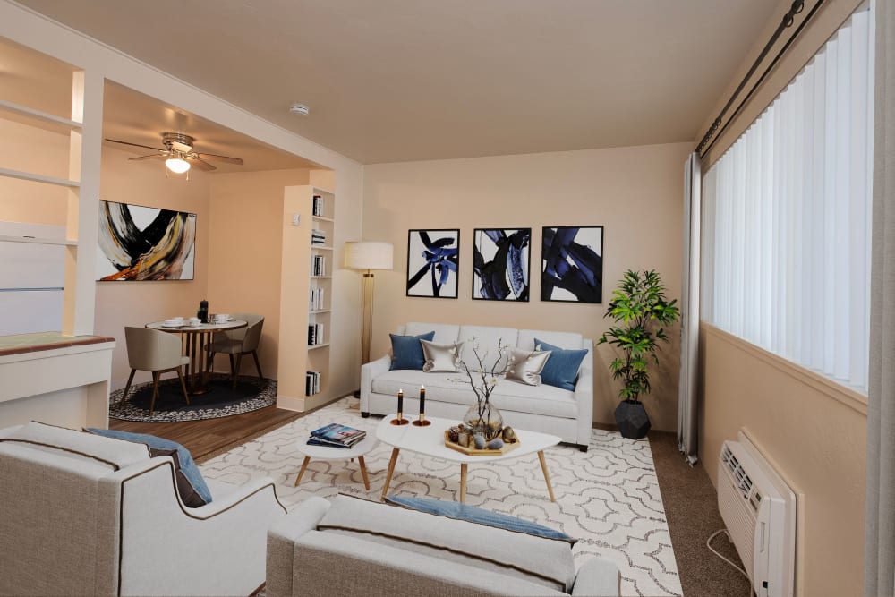 Living room and dining room area at Coralaire Apartments in Sacramento, California