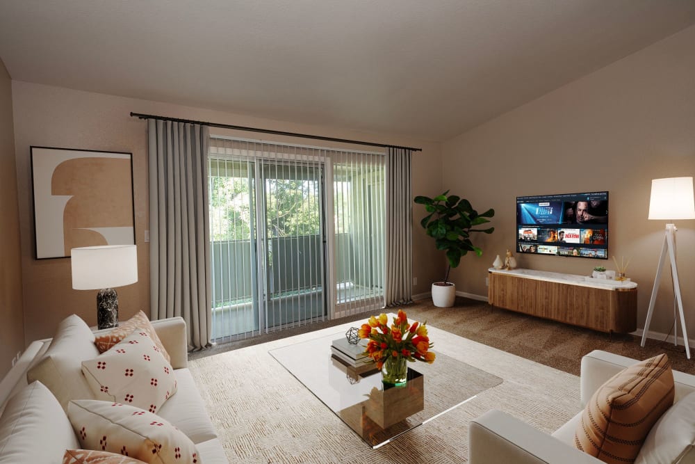 Living room with balcony at Castle Hill Apartments in Sacramento, California