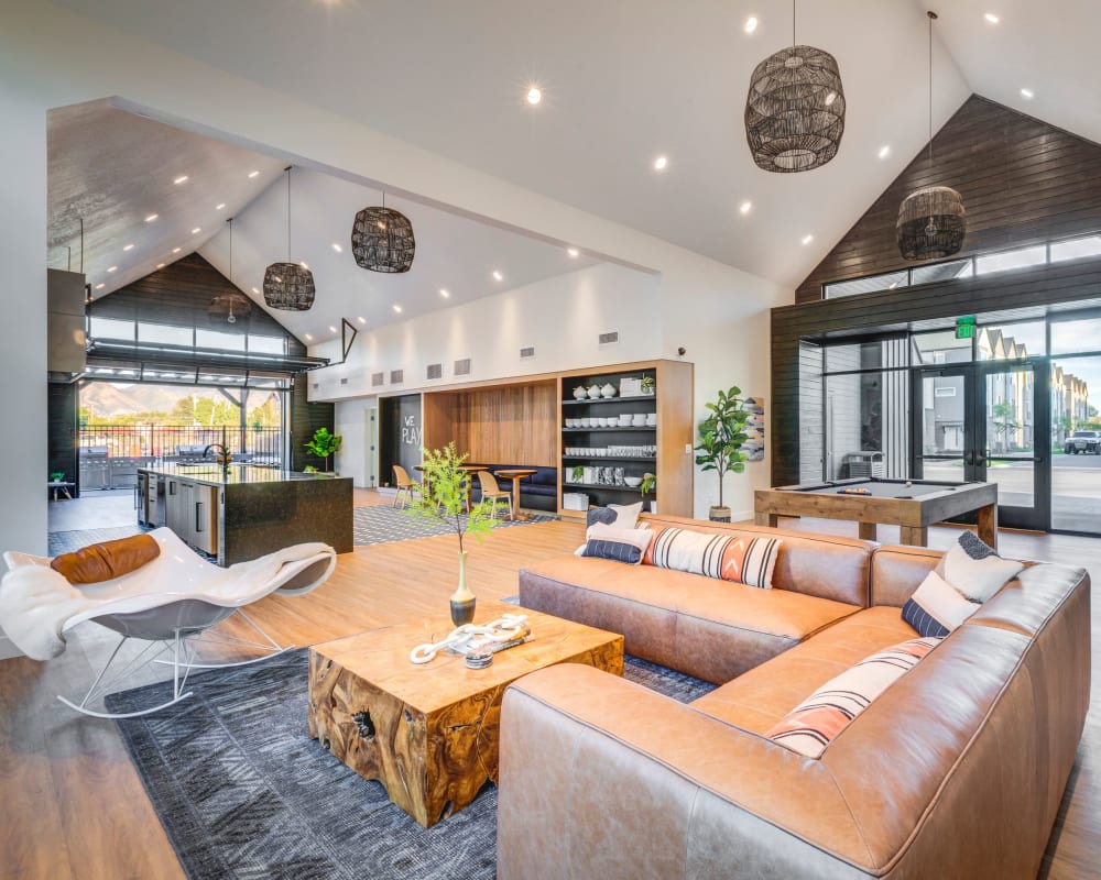 A large open clubhouse with plenty of comfortable seating at Hawthorne Townhomes in South Salt Lake, Utah