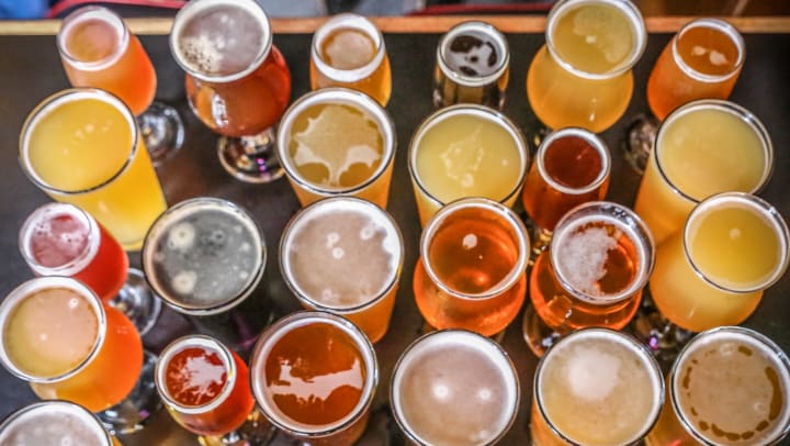 A high-angle shot of craft beers in a variety of flavors