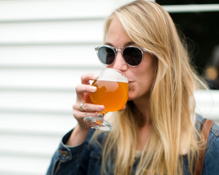 Resident sampling a craft brew at Sofi Lake Oswego in Lake Oswego, Oregon