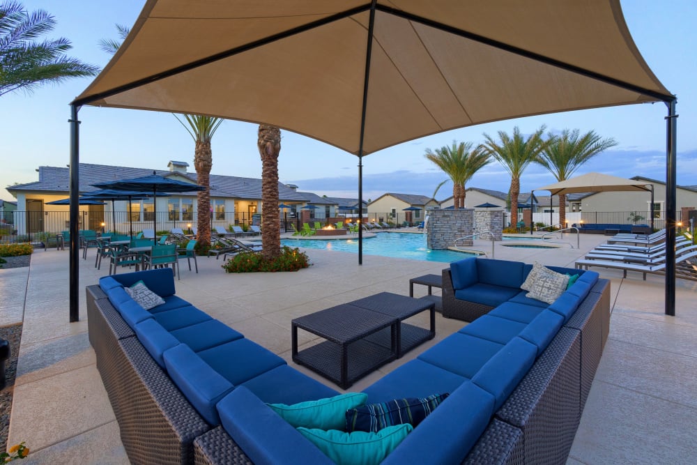 Outdoor lounging around the pool accommodations at Estia Windrose in Litchfield Park, Arizona