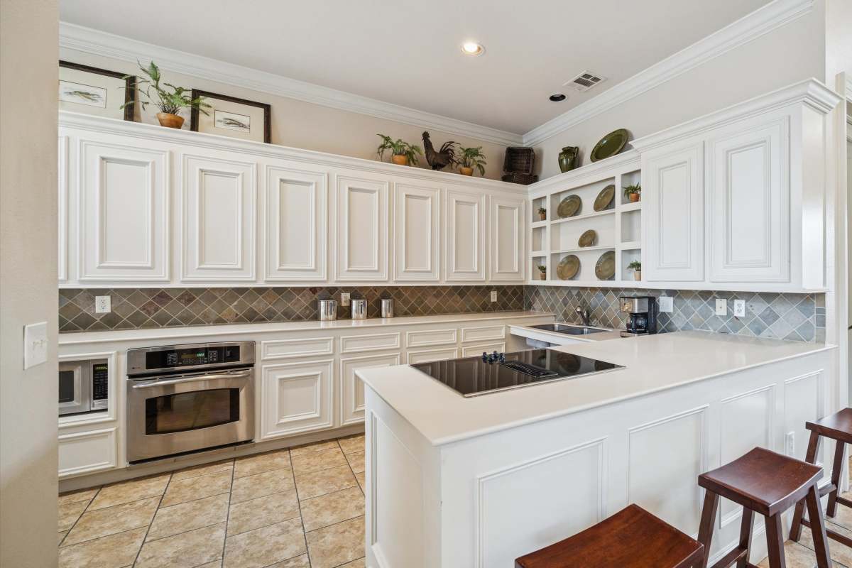 Kitchen with stainless-steel appliances at Bristol Apartments in Houston, Texas