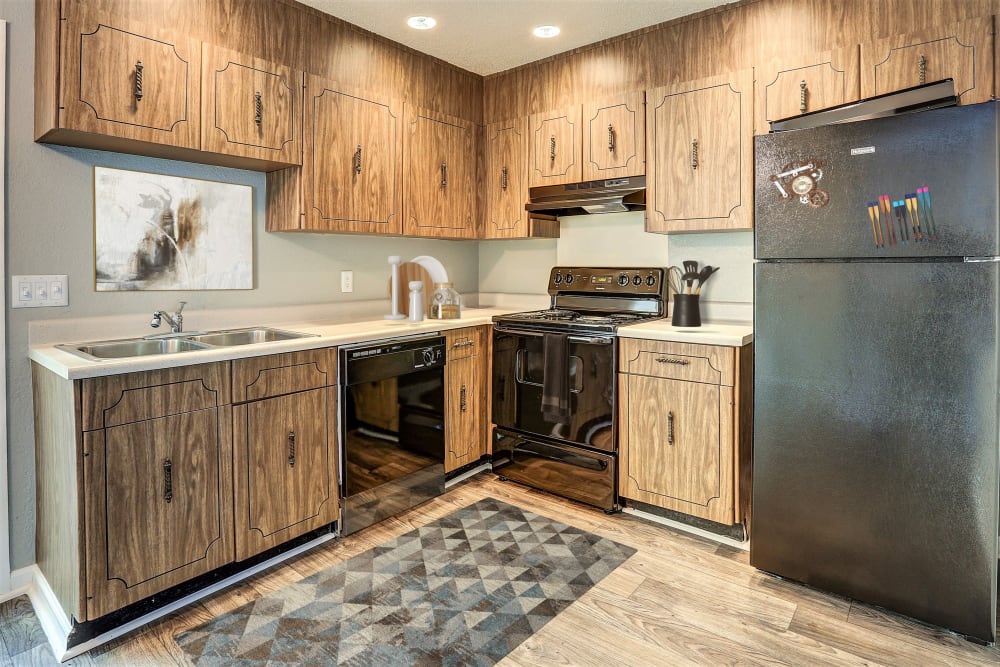 Living room with nice floors at Country Oaks Apartments in Hixson, Tennessee