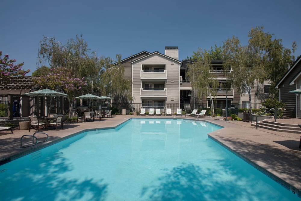 Resort-style spa and swimming pool at The Reserve at Capital Center Apartment Homes in Rancho Cordova, California