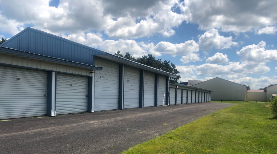 Outdoor storage units next to a lawn at KO Storage of Becker in Becker, Minnesota