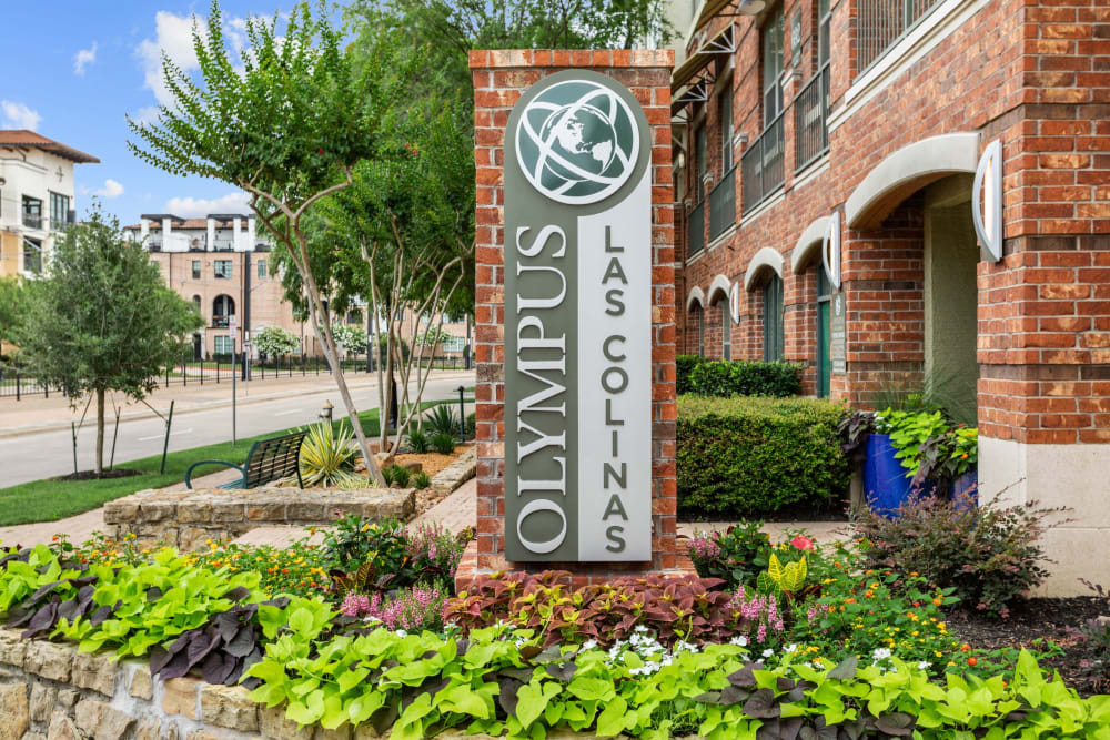 Our sign welcoming all to Olympus Las Colinas in Irving, Texas