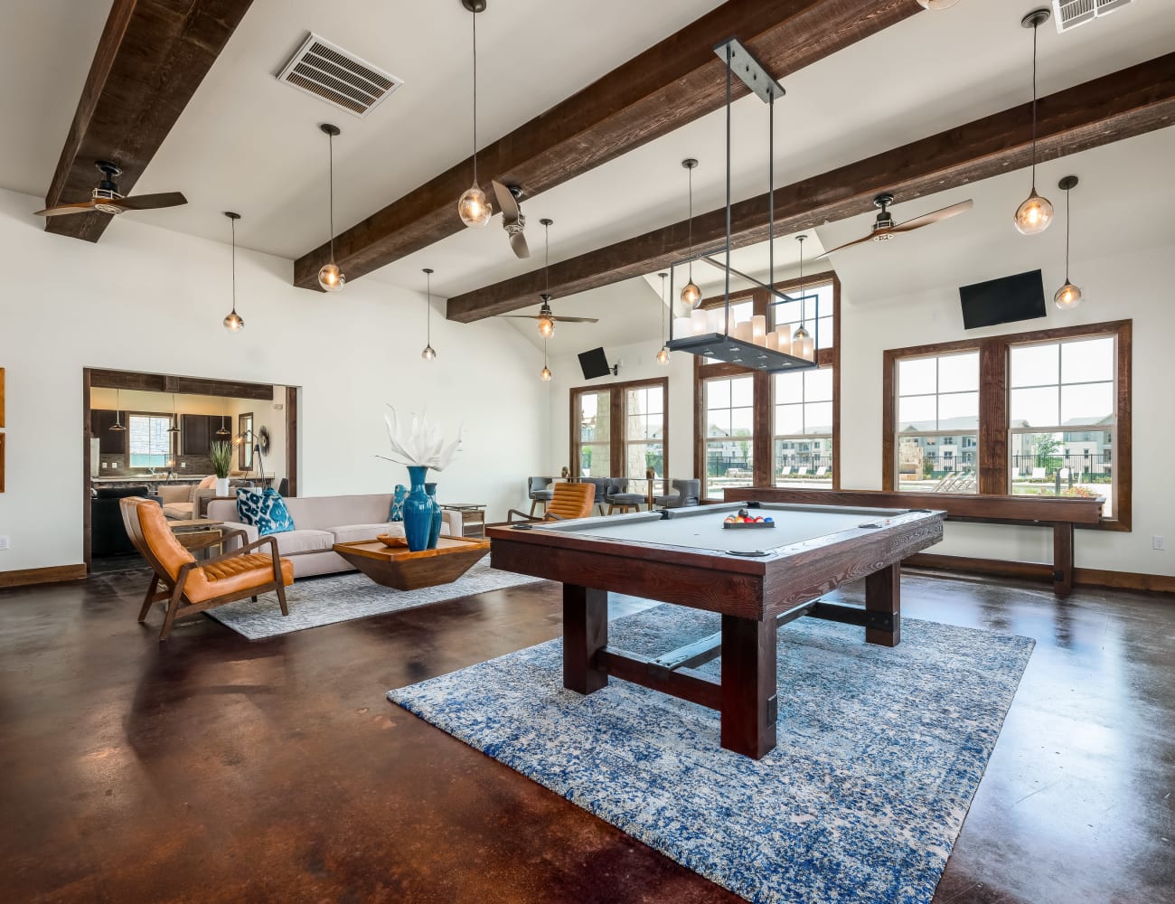 Resident clubhouse with billiards table and more at 4 Corners Apartments in Frisco, Texas