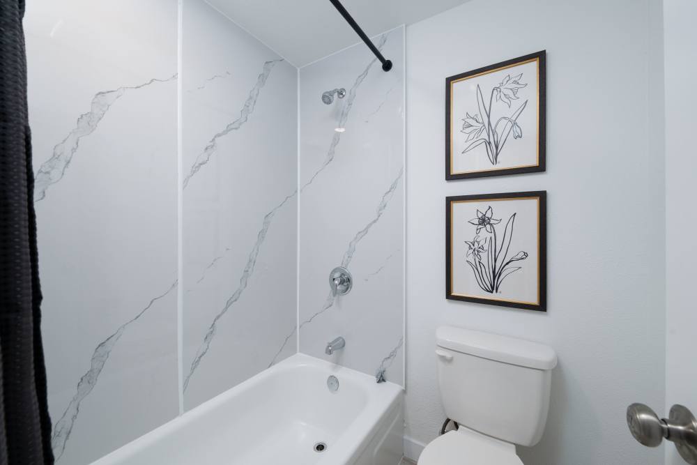 Large tub showers and brand new bathrooms at Pinnacle Point Apartments in Fife, Washington   