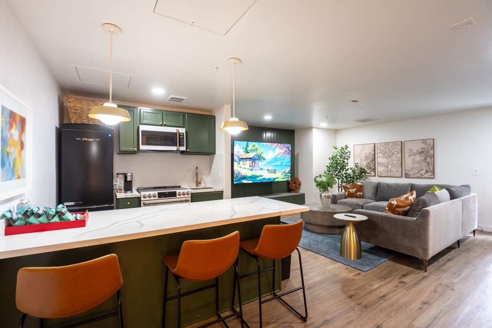 Community Lounge with game room and TV at The Theodore in Tacoma, Washington