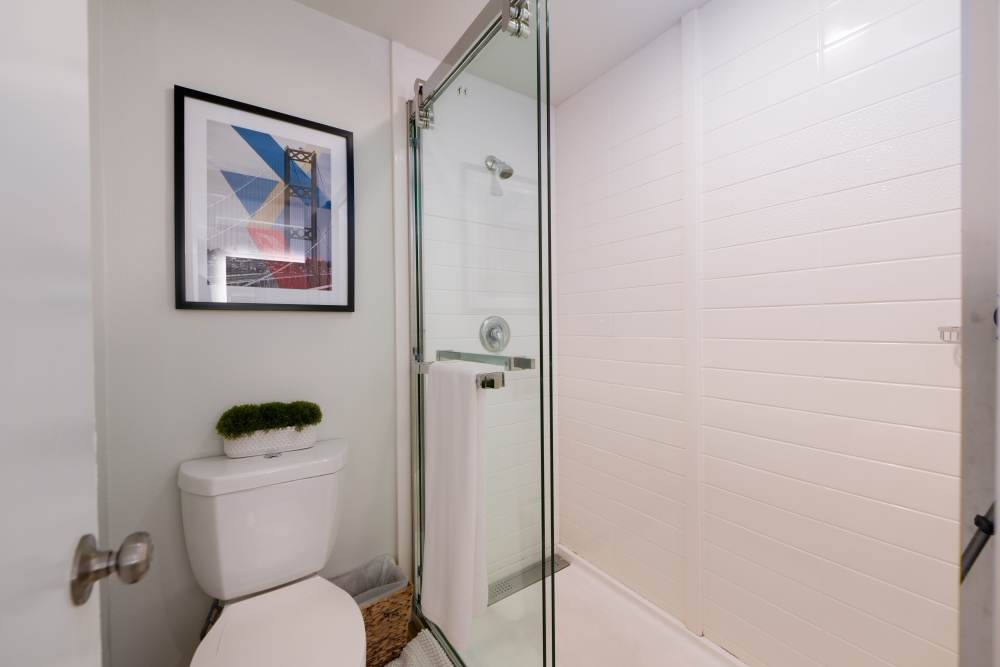 Furnished model apartment home with modern bathroom at Thea Apartments in Tacoma, Washington.