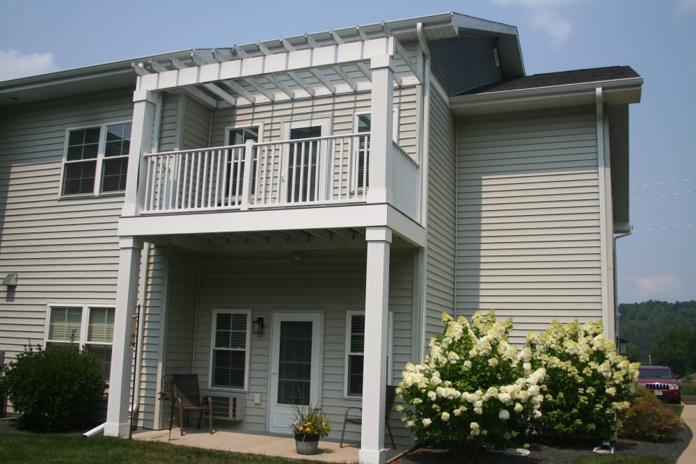 Sun porch with patio seating at Milestone Senior Living Cross Plains in Cross Plains, Wisconsin.