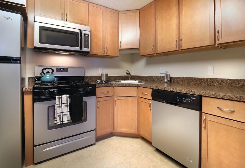 Kitchen with stainless steel appliances at Middlesex Crossing in Billerica, Massachusetts