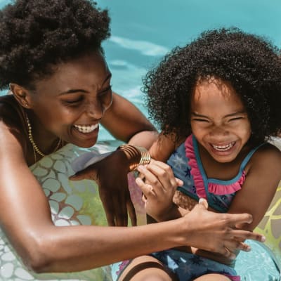 Mother and daughter in swimming pool at Constellation Park in Lemoore, California