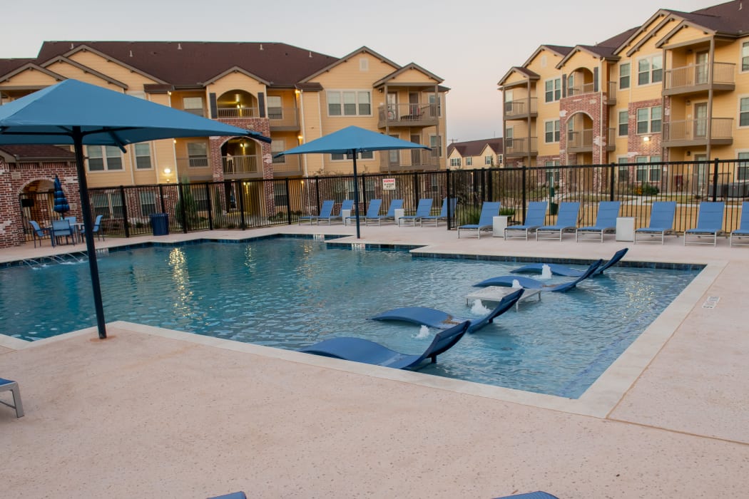Beautiful pool for residents to enjoy at Portico at Friars Creek Apartments in Temple, Texas