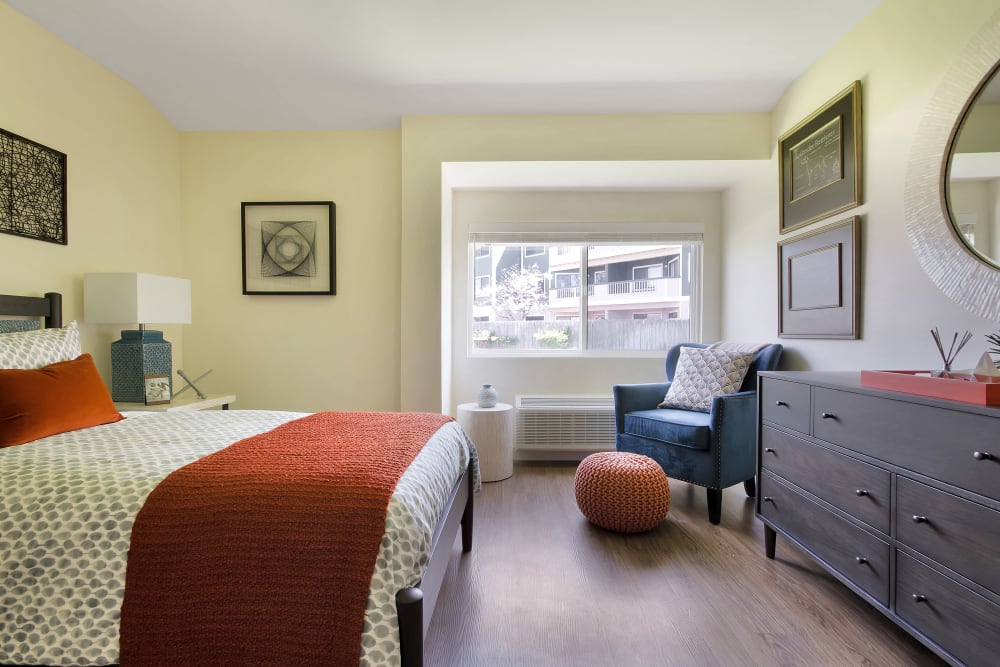 Resident bedroom with hardwood floors at Madonna Gardens in Salinas, California.
