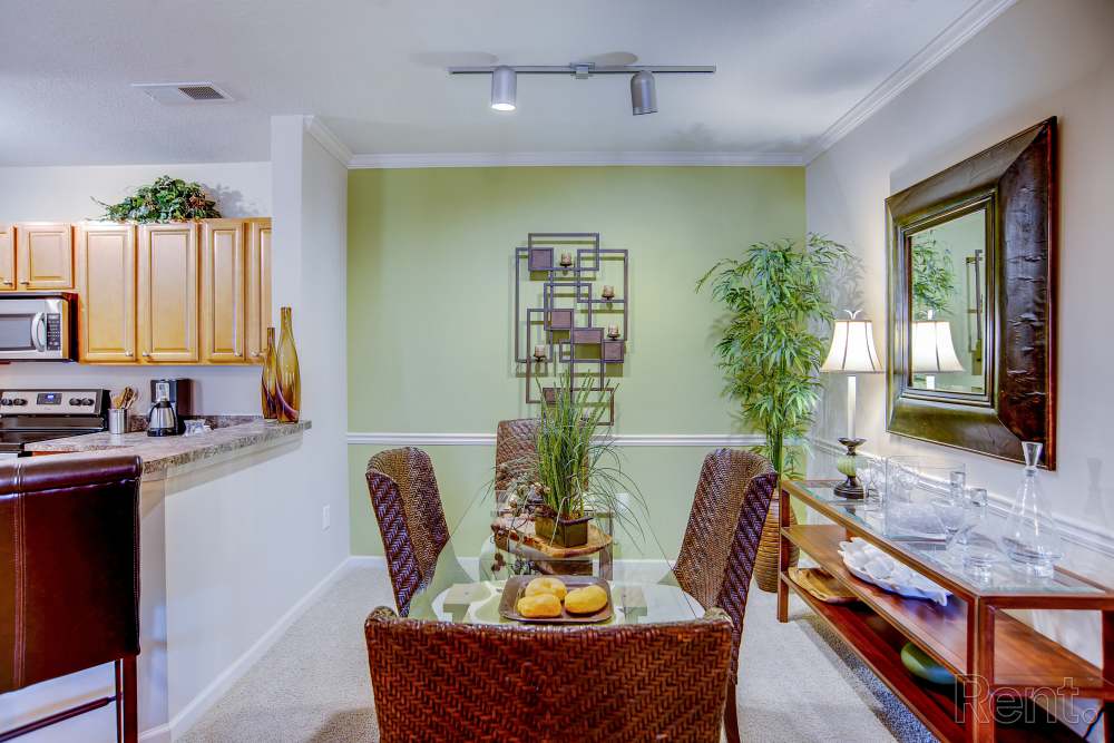 Modern living room with a dining table at Highland Hills Apartments in Dothan, Alabama