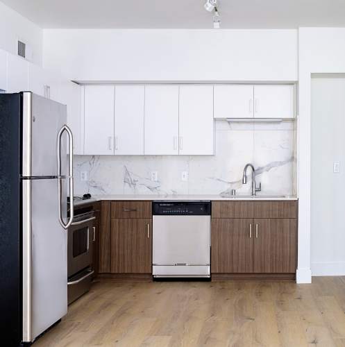 Kitchen with marble backsplash at 1801L Apartments in Sacramento, California