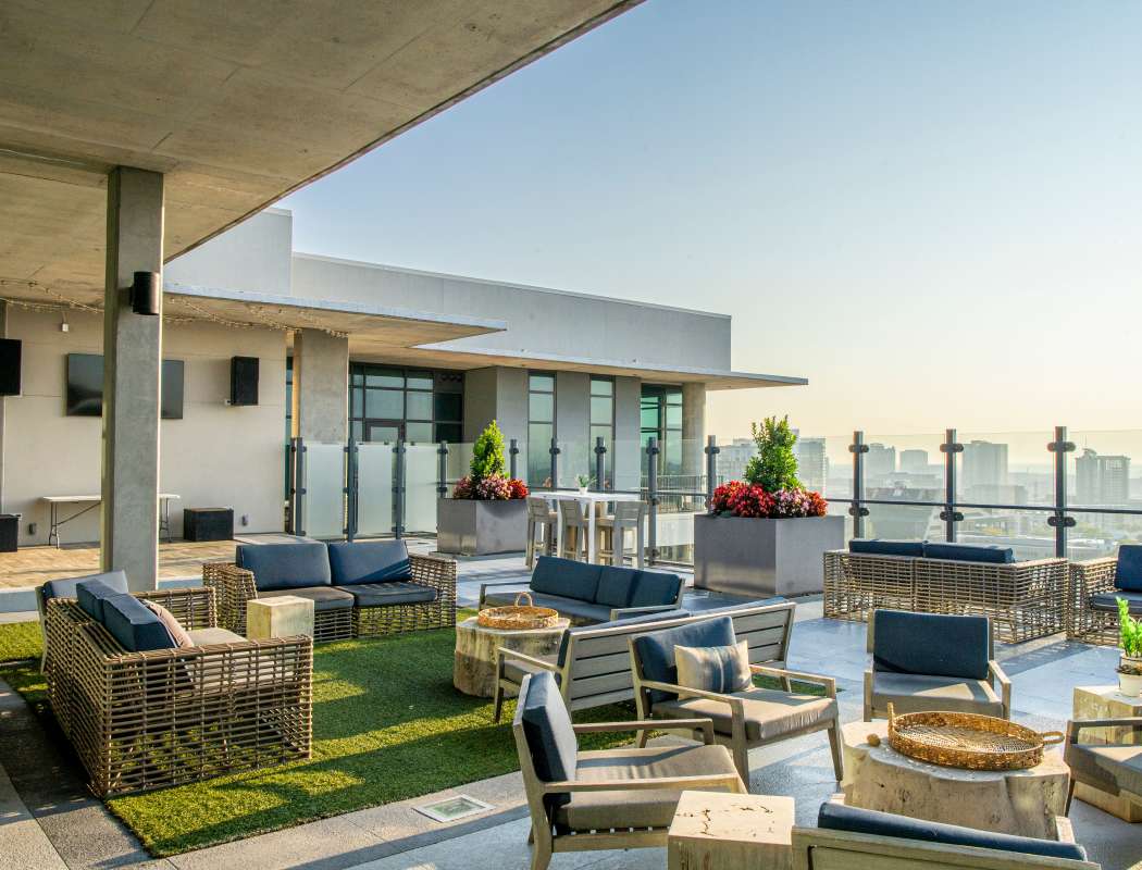 Rooftop deck seating with view of city at The Morris in Nashville, Tennessee