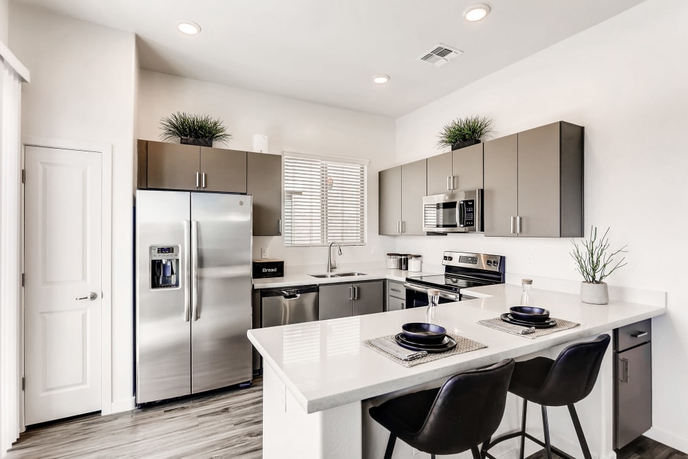 Kitchen with breakfast bar at Avilla Camelback Ranch in Phoenix AZ