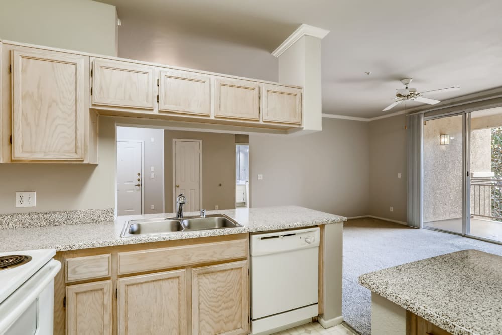 Kitchen with a breakfast bar at Alicante Apartment Homes in Aliso Viejo, California