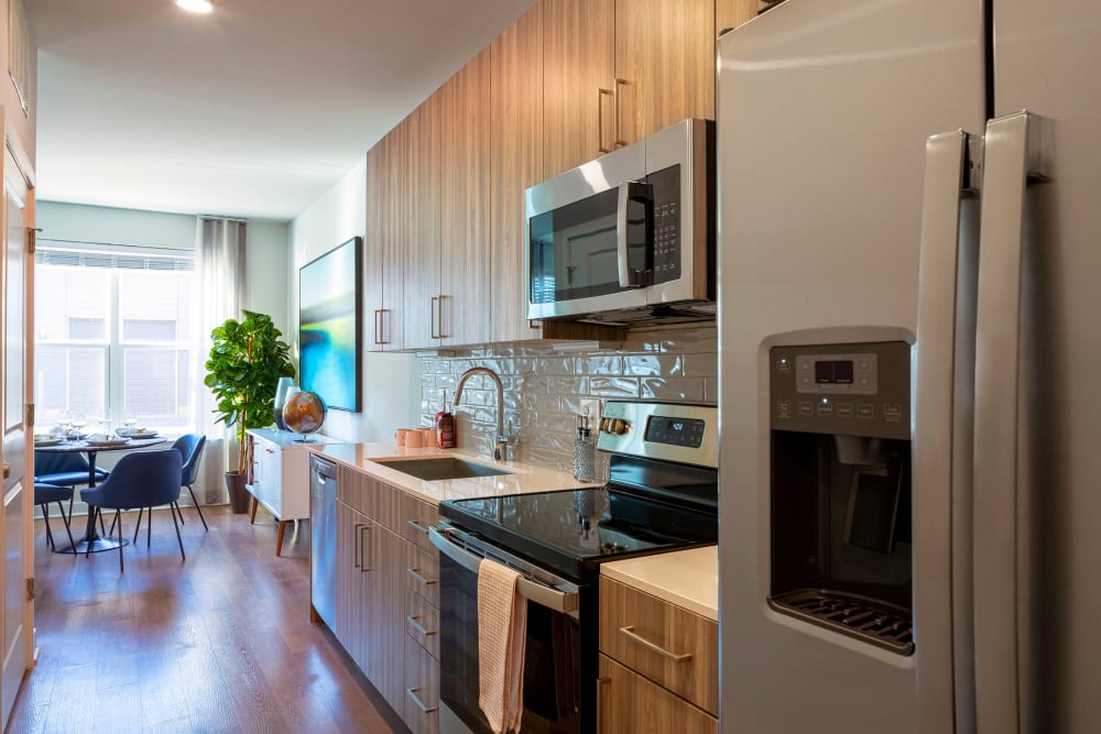 Kitchen with stainless steel appliances at Everly in Largo, Maryland