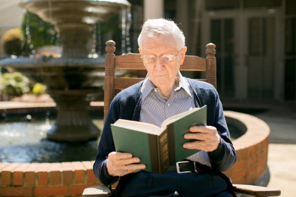 A resident reading at Wesley Gardens in Montgomery, Alabama