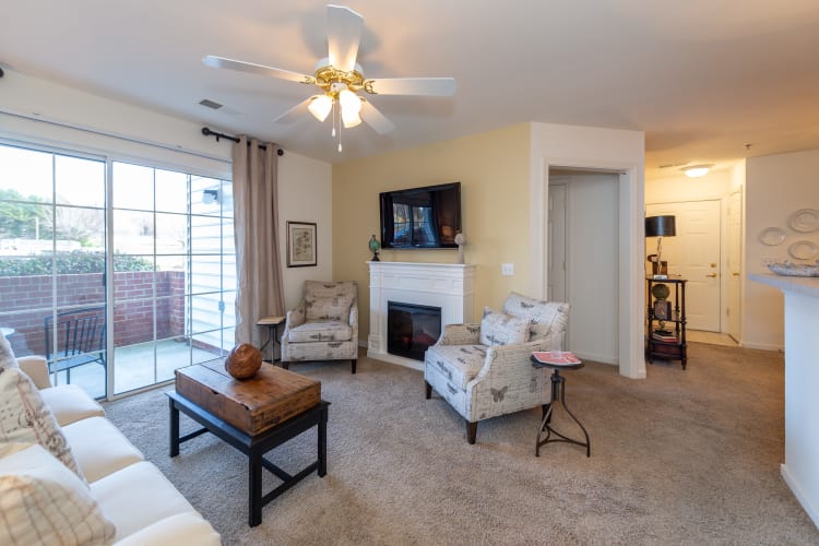 Spacious living room with a backyard view in a model home at The Overlook at Stonemill in Lynchburg, Virginia