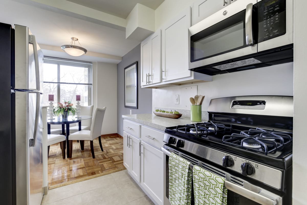 Spacious kitchen with stainless steel appliances in a model home at The Brandywine Apartments in Washington, District of Columbia