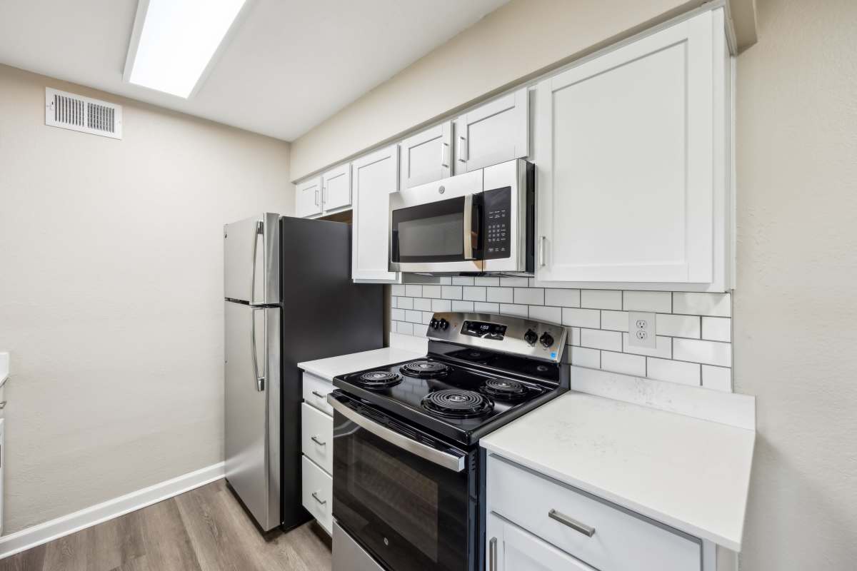 Upgraded kitchen with stainless-steel appliances at Aspen Lodge in Overland Park, Kansas