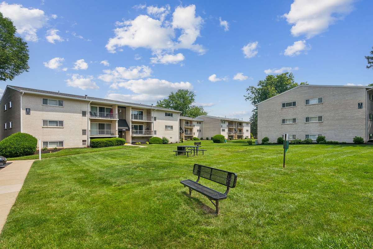 Open courtyard with seating and grilling areas at Suburban Park in York, Pennsylvania