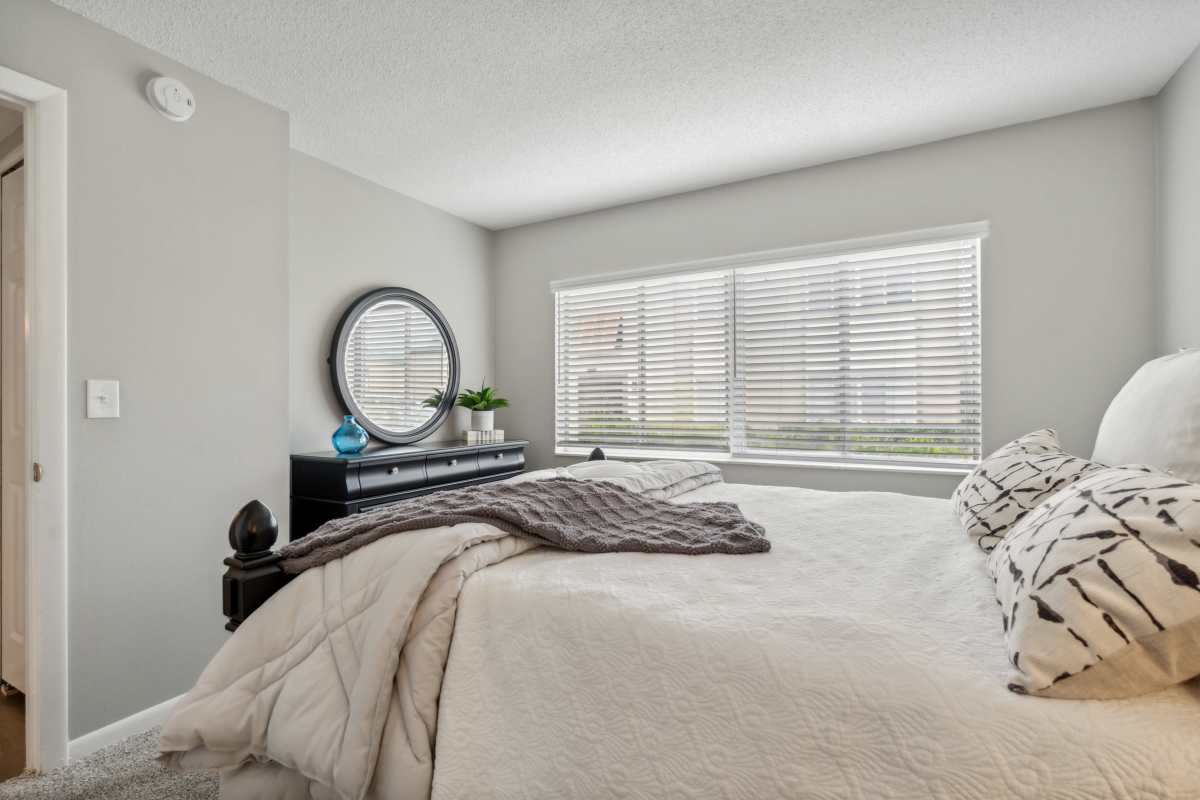 Resident bedroom with ample natural light at Buena Vista in Seminole, Florida