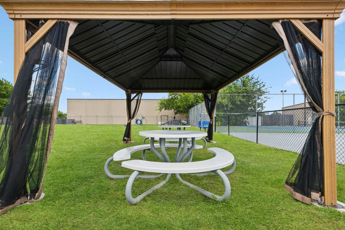 Gazebo with seating at on-site pet park at Stonehill in Killeen, Texas