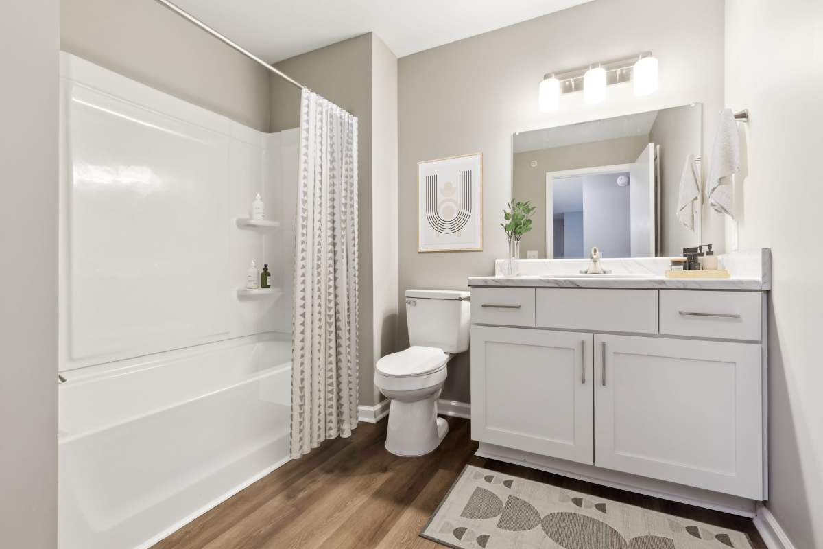 Newly renovated bathroom with shower tub at Barrington Parc in Moody, Alabama