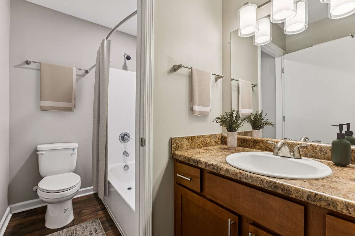 Model bathroom with shower tub at Ashford Place in Clarksville, Tennessee