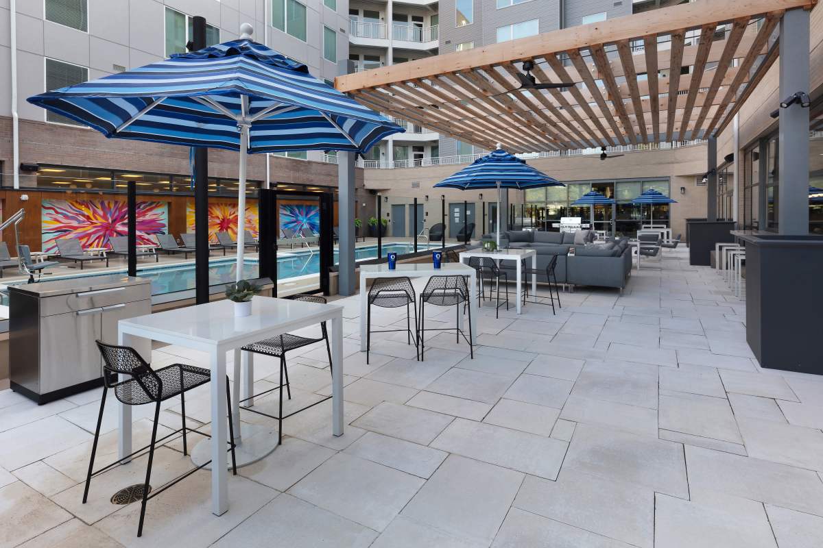 Swimming pool area with lounge seating at The Blake in Alexandria, Virginia
