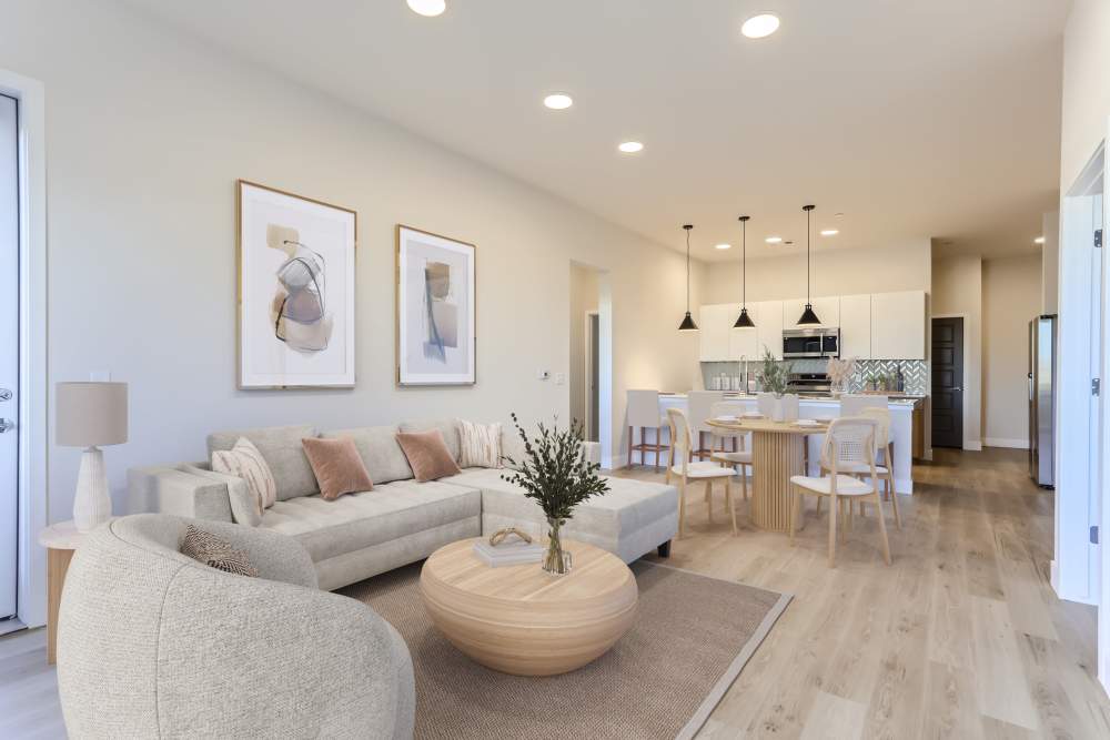 Spacious living room connected to dining at Flats on the A in Aurora, Colorado
