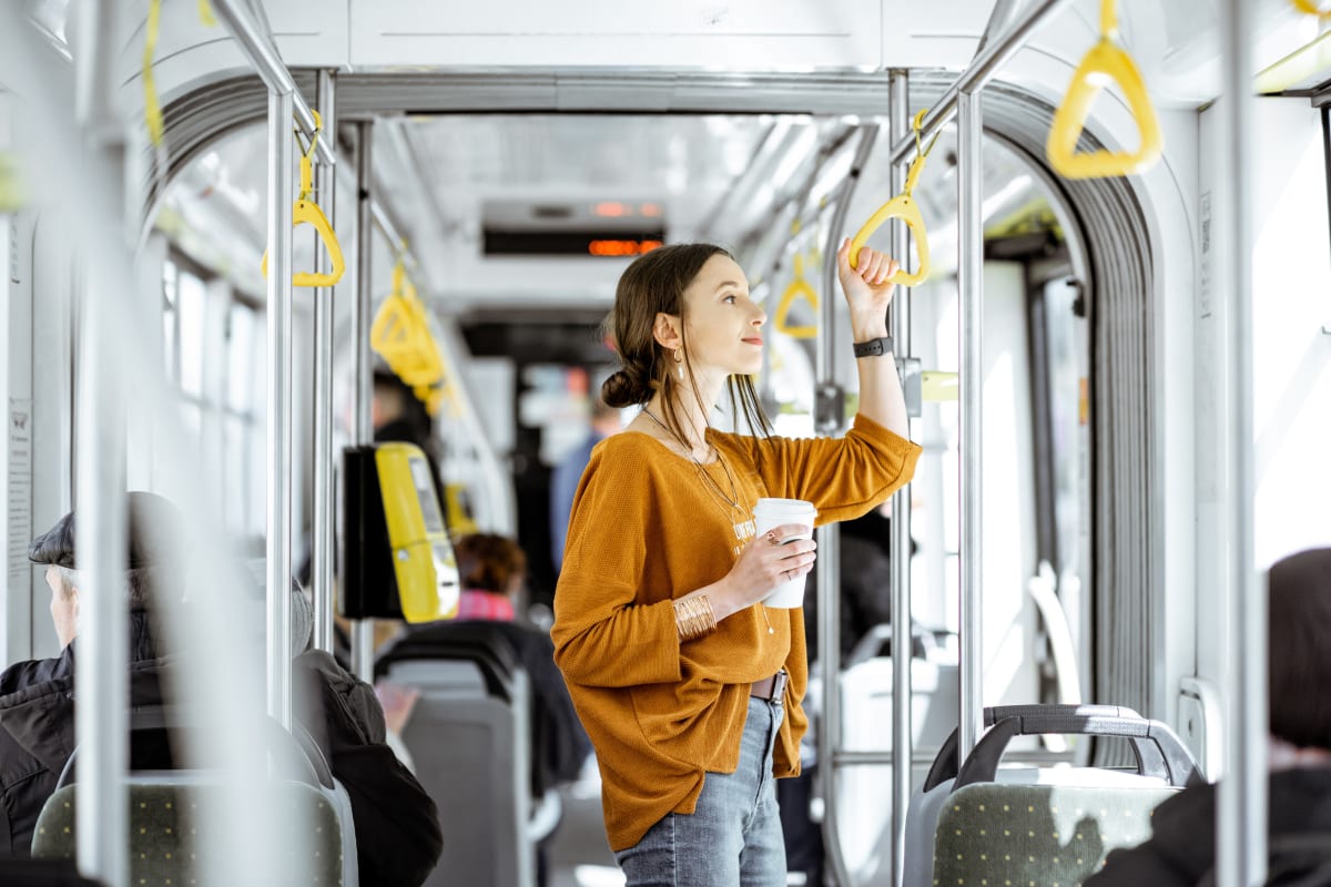 Resident enjoying A bus ride to work from her home at Fox and Hounds Apartments in Columbus, Ohio