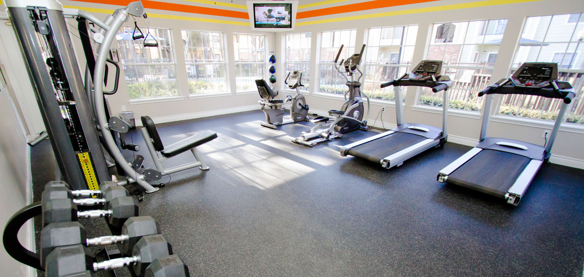 Modern fitness center at Eagle Crest Apartments in Humble, Texas