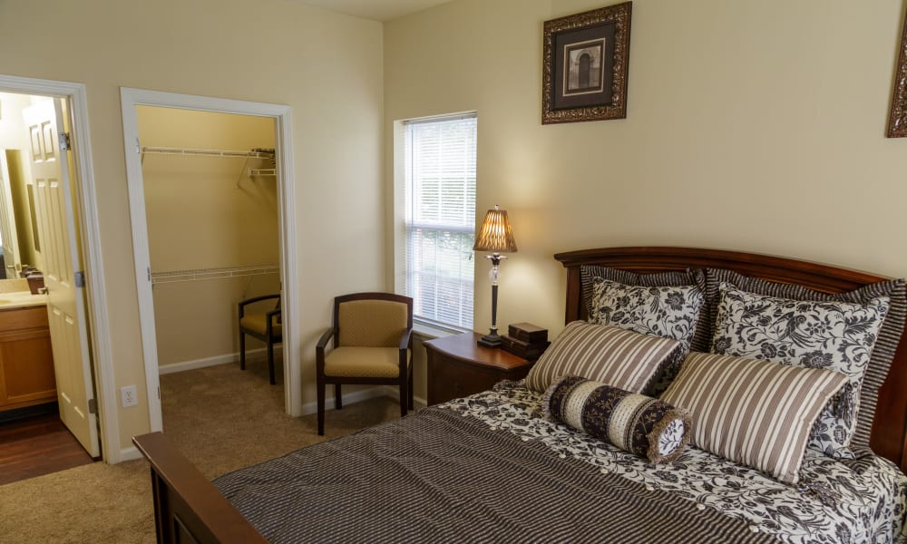 A primary bedroom suite at Peine Lakes in Wentzville, Missouri