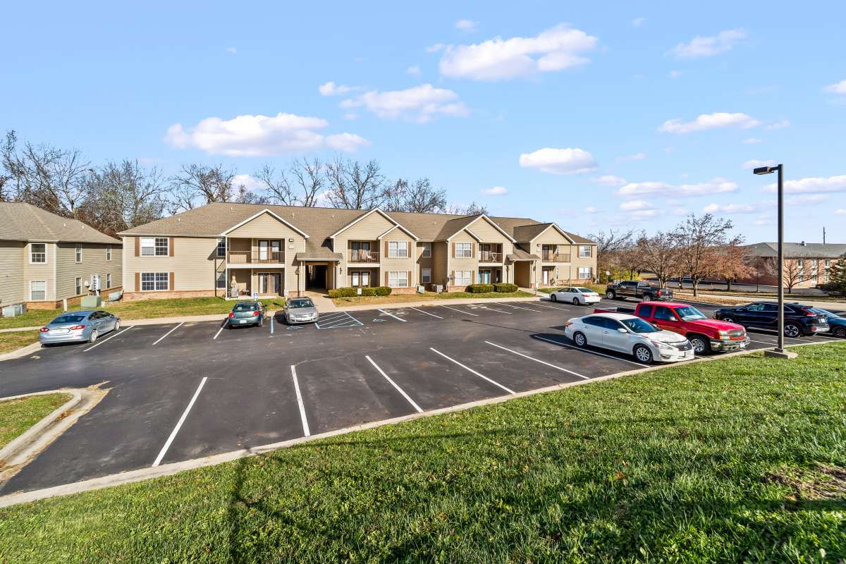 Parking facility and apartment view at Callaway Village Apartments in Fulton, Missouri