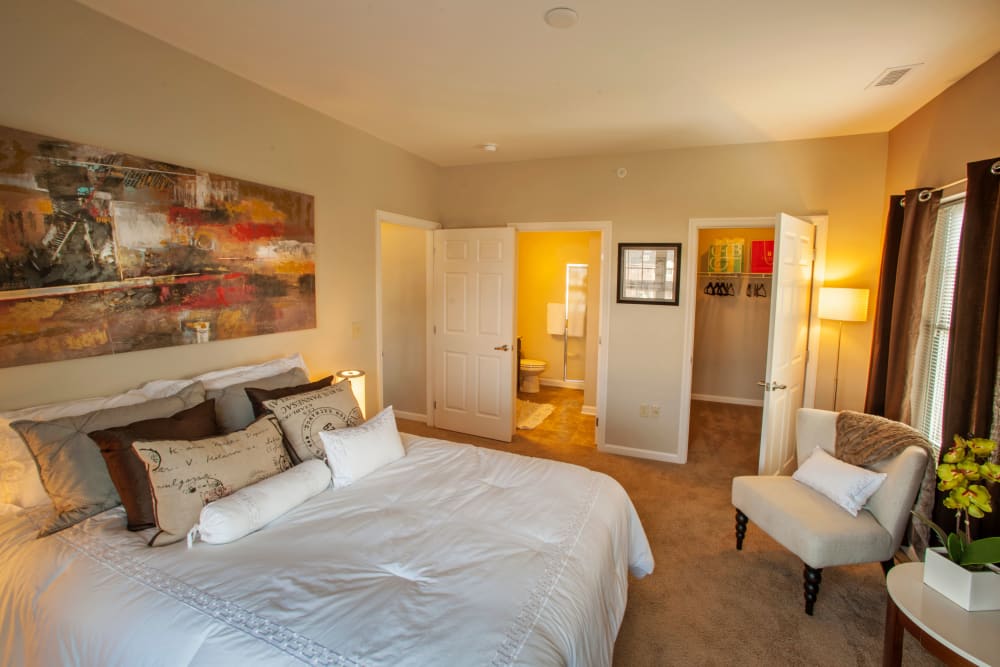 Bedroom with ensuite bathroom and walk-in closet at Rochester Village Apartments at Park Place in Cranberry Township, Pennsylvania
