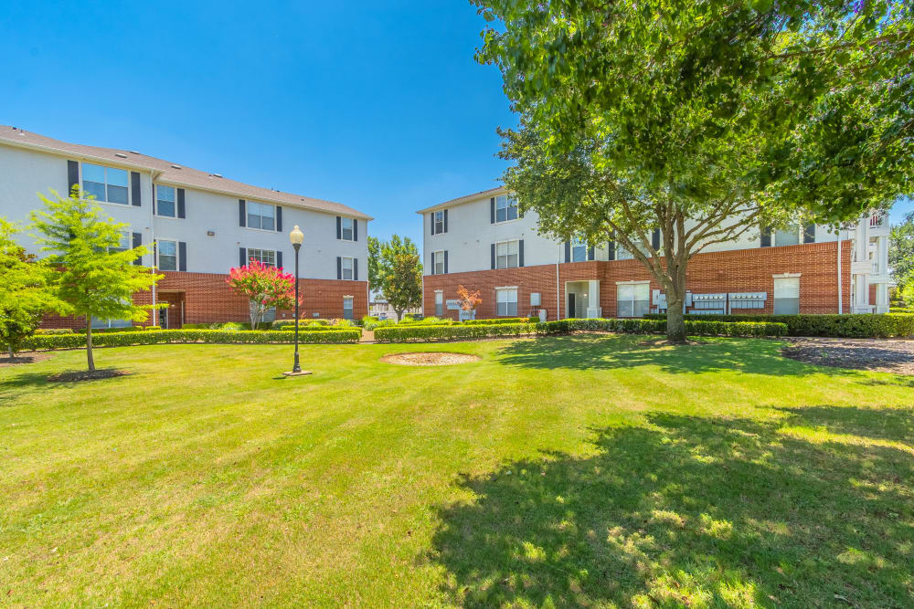 Lovely apartment buildings with large green space at The Spring at Silverton in Fort Worth, Texas.