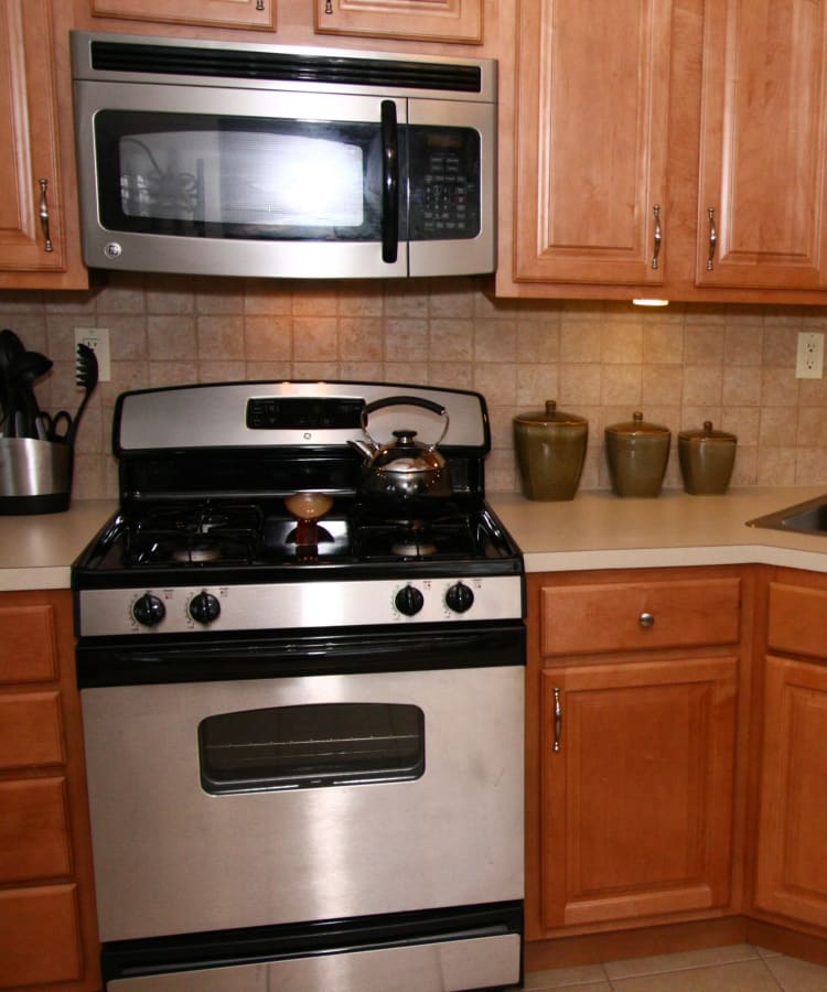 Kitchen with maple cabinetry at Center Grove Village