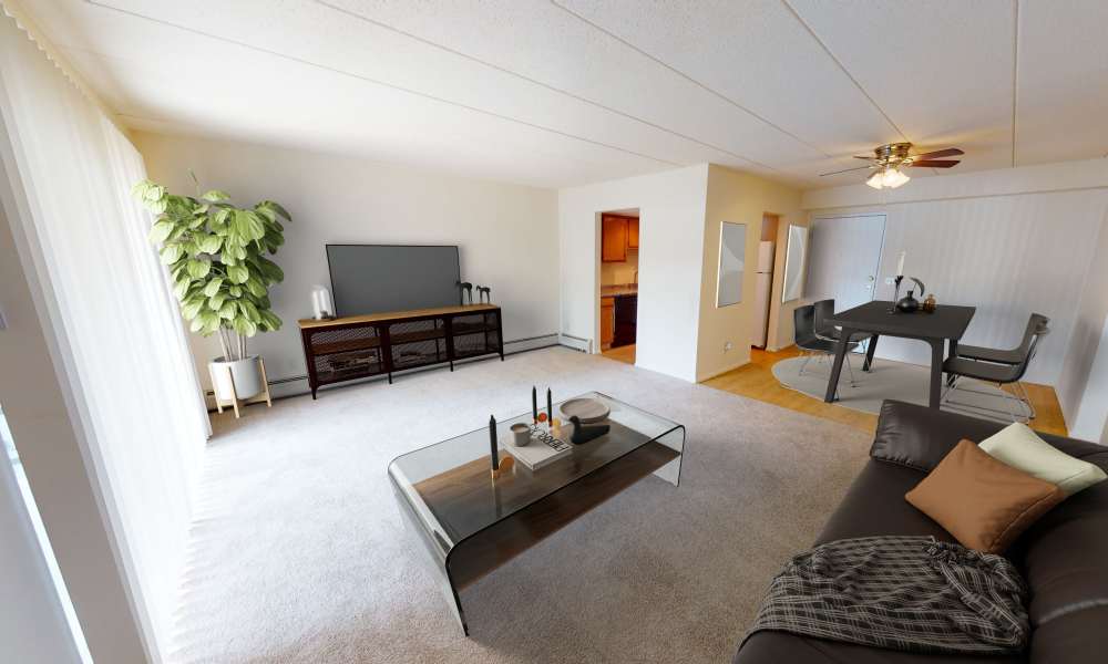 Well-lit living room with a large sliding door at Vantage Pointe West Apartment Homes in Cincinnati, Ohio