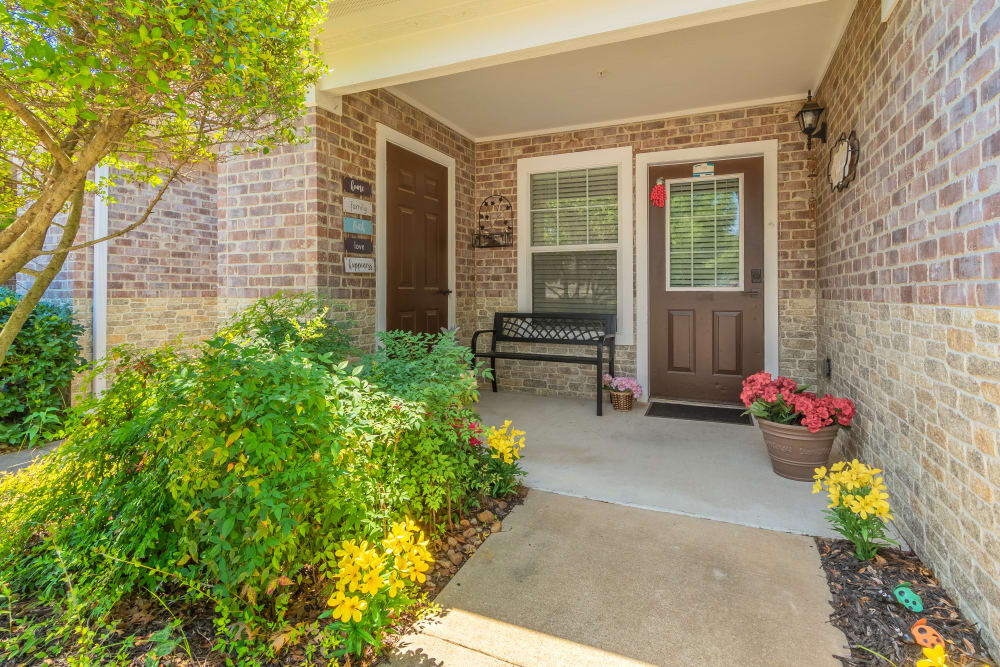 Front door and patio area of cottage residences at Sunstone Village in Denton, Texas.