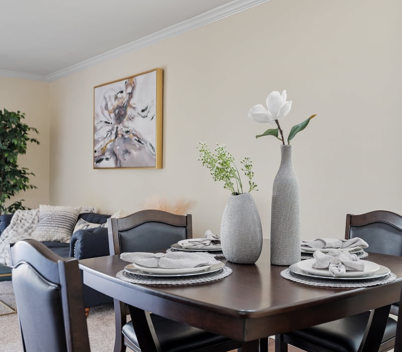 Dining table set for four in model home at The Crossroads in Van Nuys, California