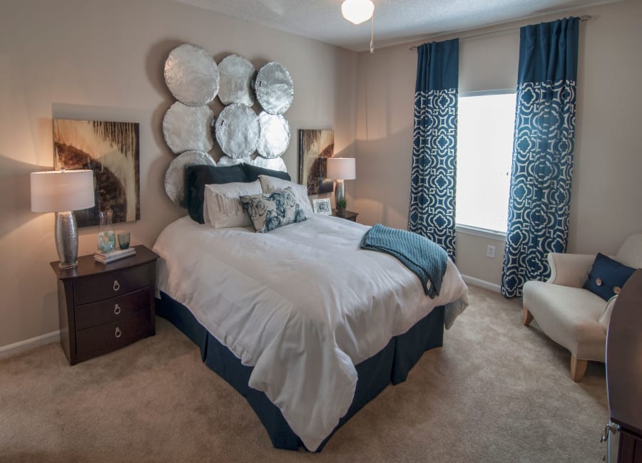 Well-decorated bedroom at Amber Chase Apartment Homes in McDonough, Georgia